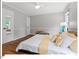 Spacious bedroom boasting hardwood floors, a ceiling fan, and plenty of natural light at 216 Brook Ln, Durham, NC 27712