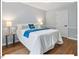 Cozy bedroom with hardwood floors, neutral walls, and good natural light at 216 Brook Ln, Durham, NC 27712