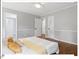 Serene bedroom with hardwood floors, closet, en suite bathroom, and a ceiling fan at 216 Brook Ln, Durham, NC 27712