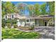 Charming home with a well-manicured lawn, established plantings and a convenient covered carport at 216 Brook Ln, Durham, NC 27712