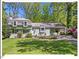 Charming home with a well-manicured lawn, established plantings and a convenient covered carport at 216 Brook Ln, Durham, NC 27712