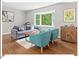 Cozy living room featuring hardwood floors, a bay window, and comfortable seating at 216 Brook Ln, Durham, NC 27712