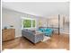 Inviting living room with hardwood floors, a bay window, and staircase visible in the background at 216 Brook Ln, Durham, NC 27712