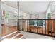 Open-concept living space with hardwood floors, light gray walls, and staircase in view at 216 Brook Ln, Durham, NC 27712