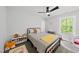 bedroom with an area rug, black metal bed, lots of natural light and toys at 2634 Turner Pines Dr, New Hill, NC 27562