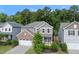 Charming two-story home featuring a brick facade, a two-car garage, and a well-manicured front yard at 2634 Turner Pines Dr, New Hill, NC 27562