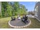 Backyard fire pit with Adirondack chairs perfect for outdoor gatherings and cozy evenings at 2634 Turner Pines Dr, New Hill, NC 27562