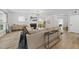 Bright living room features a fireplace, large windows, and modern lighting fixtures at 2634 Turner Pines Dr, New Hill, NC 27562