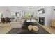 This inviting living room includes a modern fireplace and connects to a dining area, perfect for Gathering gatherings at 2634 Turner Pines Dr, New Hill, NC 27562