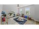 Bright playroom with a rug, play house, rocking horse and lots of natural light at 2634 Turner Pines Dr, New Hill, NC 27562