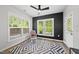 Sitting room features a plush rug, neutral decor, and plenty of natural light at 2634 Turner Pines Dr, New Hill, NC 27562