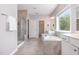 Luxurious bathroom features a soaking tub, walk-in shower, and dual vanities at 2885 Farmhouse Dr, Apex, NC 27502