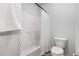 Bathroom showcasing a tub with shower, a white shower curtain, and a toilet at 2885 Farmhouse Dr, Apex, NC 27502