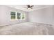 Spacious bedroom with a ceiling fan and bright, sunlit windows at 2885 Farmhouse Dr, Apex, NC 27502