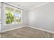 Bright, airy bedroom with large window offering pleasant outdoor views at 2885 Farmhouse Dr, Apex, NC 27502