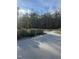 Scenic view of a bike rack near a paved path, surrounded by lush greenery and trees at 2885 Farmhouse Dr, Apex, NC 27502