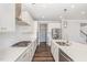 Bright kitchen featuring white cabinets, stainless steel appliances, a gas cooktop, and a central island at 2885 Farmhouse Dr, Apex, NC 27502