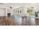 Spacious living room with a fireplace, large windows and sliding doors leading to a covered porch at 2885 Farmhouse Dr, Apex, NC 27502