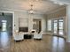 Comfortable lounge featuring modern chandelier, neutral walls, and stylish seating arrangements at 2885 Farmhouse Dr, Apex, NC 27502
