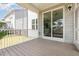 A screened-in porch with sliding doors leading to the home's interior at 2885 Farmhouse Dr, Apex, NC 27502
