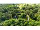 Aerial view of an expansive property surrounded by lush greenery, showcasing estimated property lines at 300 Plantation Rd, Clayton, NC 27520