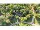 Aerial view of home showcasing its positioning within a lush, tree-filled landscape at 300 Plantation Rd, Clayton, NC 27520
