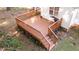 New backyard deck with wood and stairs, along with a grill, overlooking the backyard at 300 Plantation Rd, Clayton, NC 27520