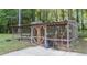 Large, enclosed chicken coop with secure fencing and ample space, perfect for poultry enthusiasts at 300 Plantation Rd, Clayton, NC 27520