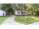Charming one story home with front porch, well manicured lawn and driveway, perfect for a relaxing lifestyle at 300 Plantation Rd, Clayton, NC 27520
