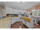 Charming kitchen with granite countertops, stainless steel appliances, and a brick accent wall in the dining nook at 300 Plantation Rd, Clayton, NC 27520