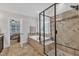 Bathroom featuring a glass shower enclosure and separate soaking tub with tile surround at 3007 Krogen Ct, Creedmoor, NC 27522