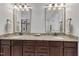 Bathroom features a granite countertop, double sinks, and wooden cabinets at 3007 Krogen Ct, Creedmoor, NC 27522