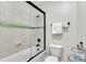 Bright bathroom featuring tiled shower, a toilet, and a rack for towels at 3007 Krogen Ct, Creedmoor, NC 27522