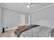 Neutral bedroom featuring a ceiling fan, carpet and a warm decorative throw blanket at 3007 Krogen Ct, Creedmoor, NC 27522
