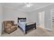 Comfortable bedroom with a chair, ceiling fan, and ample natural light from the window at 3007 Krogen Ct, Creedmoor, NC 27522