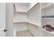 Bright, white walk-in closet with built-in shelving and ample storage space at 3007 Krogen Ct, Creedmoor, NC 27522