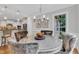 Bright dining area features a modern chandelier, round table, and neutral walls at 3007 Krogen Ct, Creedmoor, NC 27522