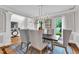Bright dining room boasts natural light, wainscoting, and stylish decor at 3007 Krogen Ct, Creedmoor, NC 27522