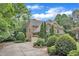 Side view of home showing driveway, two car garage, and well maintained yard and landscaping at 3007 Krogen Ct, Creedmoor, NC 27522