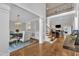 Bright open-concept foyer showcasing hardwood floors, staircase, dining room, and living room at 3007 Krogen Ct, Creedmoor, NC 27522