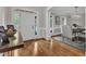 Bright entryway with hardwood floors, white trim, and a view into the dining room at 3007 Krogen Ct, Creedmoor, NC 27522
