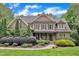 Beautiful two-story home with manicured landscaping, stone accents, and a welcoming front porch at 3007 Krogen Ct, Creedmoor, NC 27522