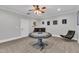 Well-lit game room featuring a ceiling fan, game table, and wet bar at 3007 Krogen Ct, Creedmoor, NC 27522