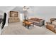 Cozy living room with comfortable sofas, ceiling fan, and a well-lit atmosphere at 3007 Krogen Ct, Creedmoor, NC 27522