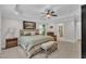 Relaxing main bedroom with tray ceilings, a ceiling fan, and neutral decor at 3007 Krogen Ct, Creedmoor, NC 27522