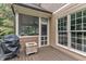 Cozy covered porch with a ceiling fan, wood flooring, and view of backyard at 3007 Krogen Ct, Creedmoor, NC 27522