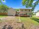 Spacious backyard view featuring a wooden deck and back entrance to the home at 3025 Creek Moss Ave, Wake Forest, NC 27587