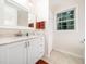Bright bathroom with white vanity, granite countertop, and framed mirror at 3025 Creek Moss Ave, Wake Forest, NC 27587
