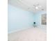 Bright bedroom featuring a ceiling fan, neutral carpet, and light blue walls at 3025 Creek Moss Ave, Wake Forest, NC 27587