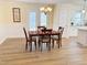 Dining room featuring a wooden table, chandelier, and adjacent kitchen at 3025 Creek Moss Ave, Wake Forest, NC 27587